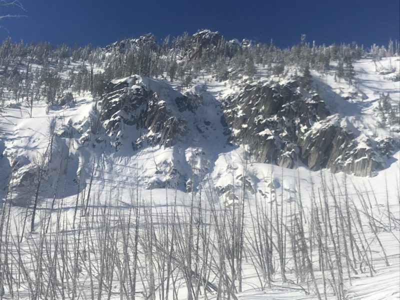 New snow sloughs from rock warming.