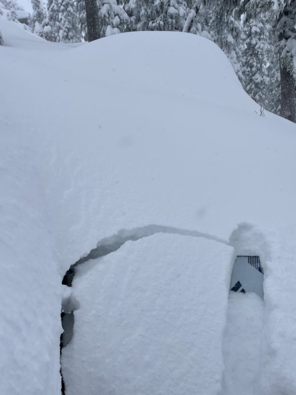 Cracking and settlement of new snow near rocks.