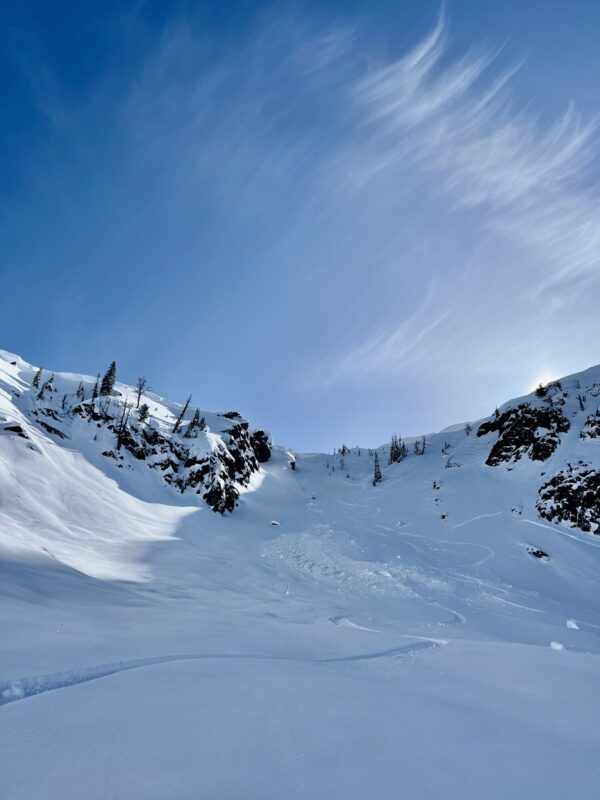 The debris from the cornice break is centered. Another crown is visible on the right below steep cliffs. Assume this failed earlier this week during the storm system.